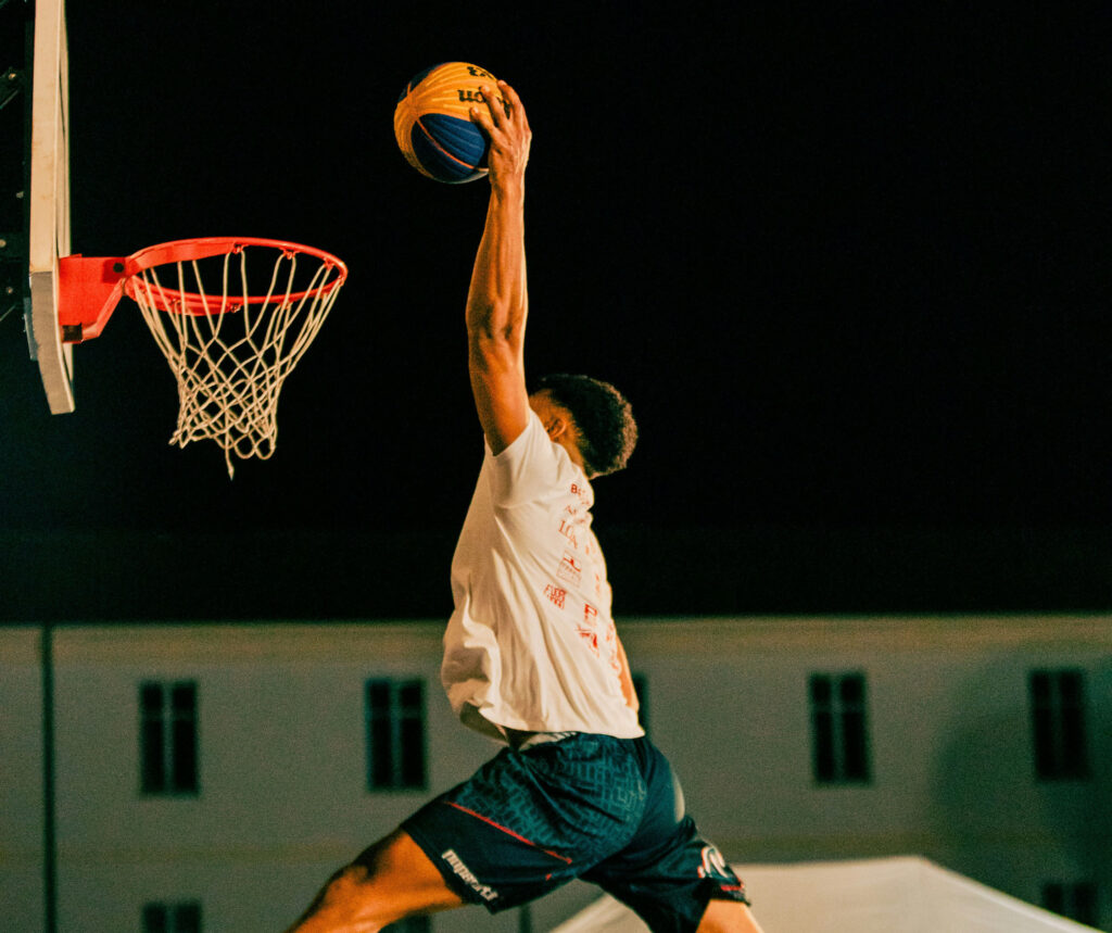 Young man dunking