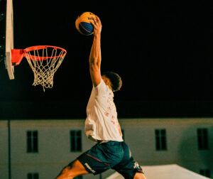 Young man dunking