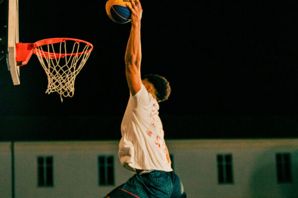 Young man dunking
