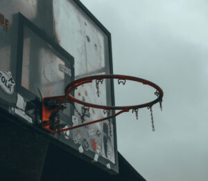 Run down basketball goal with no net.