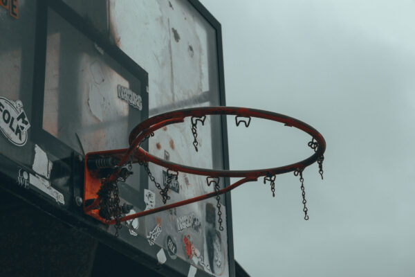 Run down basketball goal with no net.