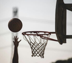 Person reaching for a missed shot