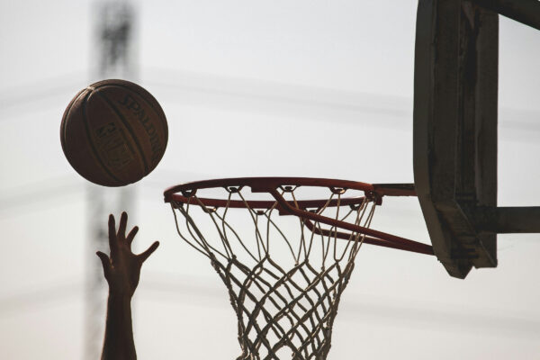 Person reaching for a missed shot